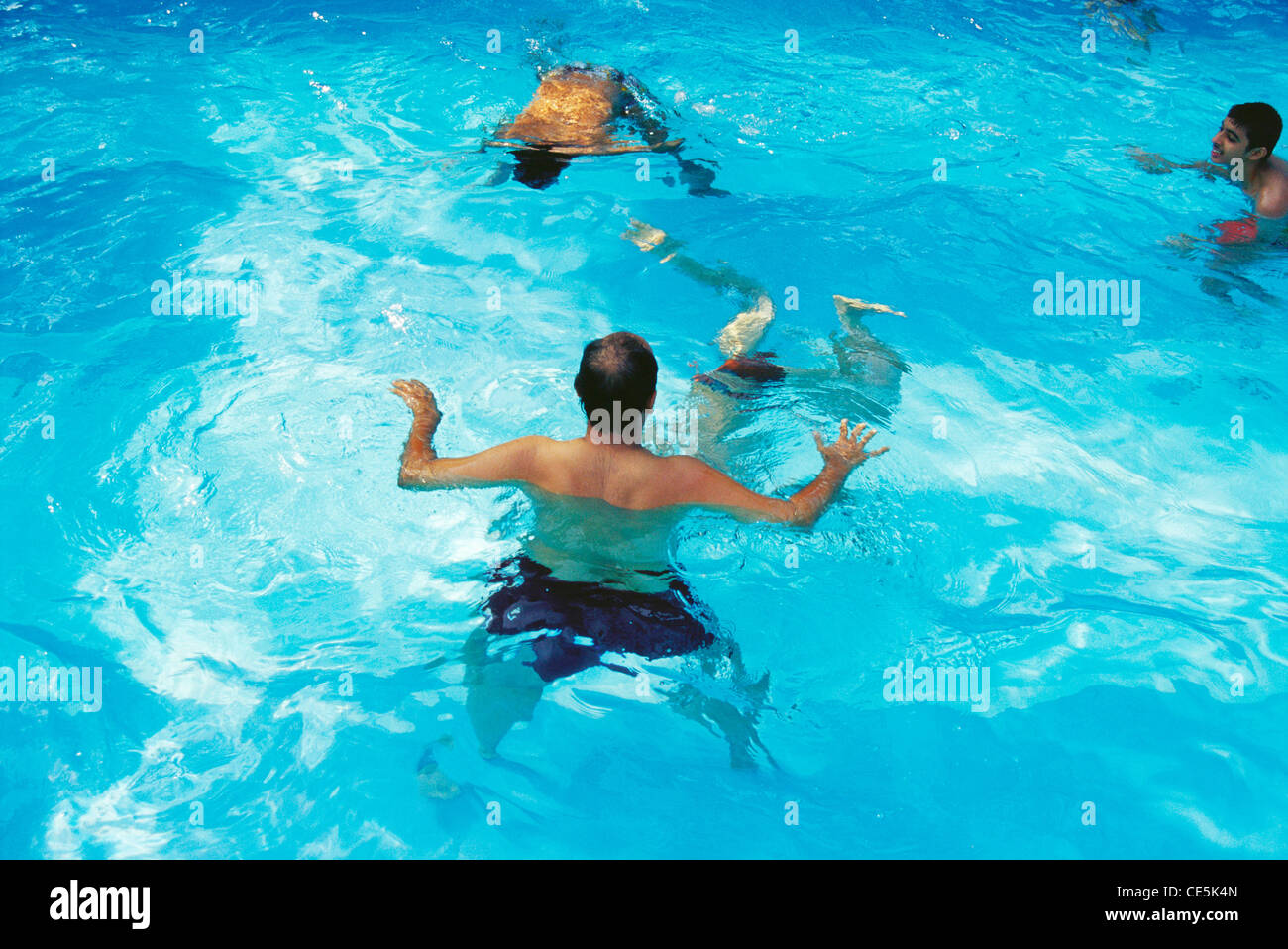 men playing in swimming pool ; MR#399 Stock Photo - Alamy