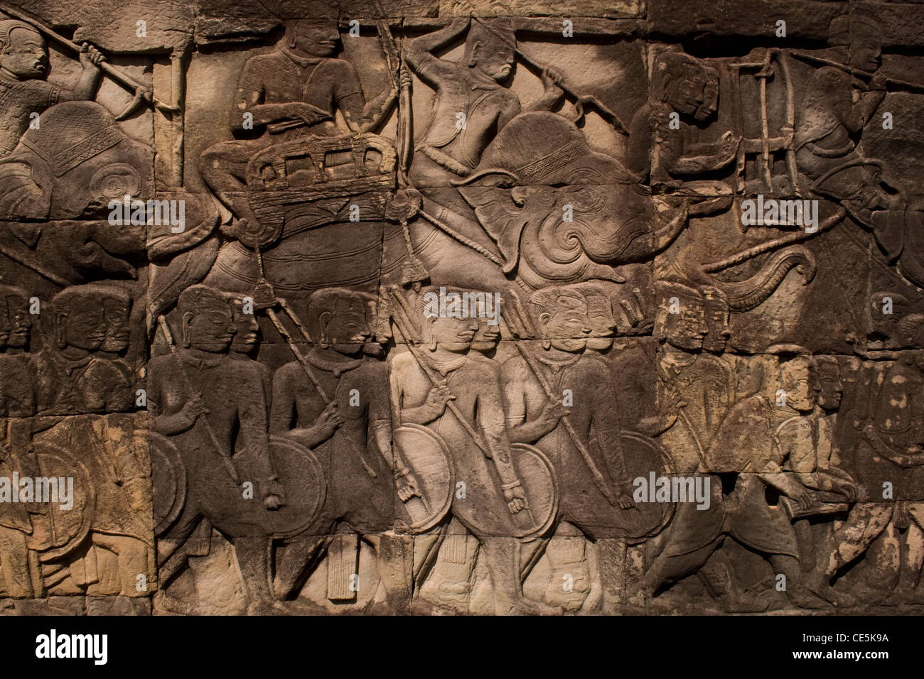 Bass reliefs depicting a Khmer army on the march at the temple of Bayon in Angkor, Cambodia. Stock Photo