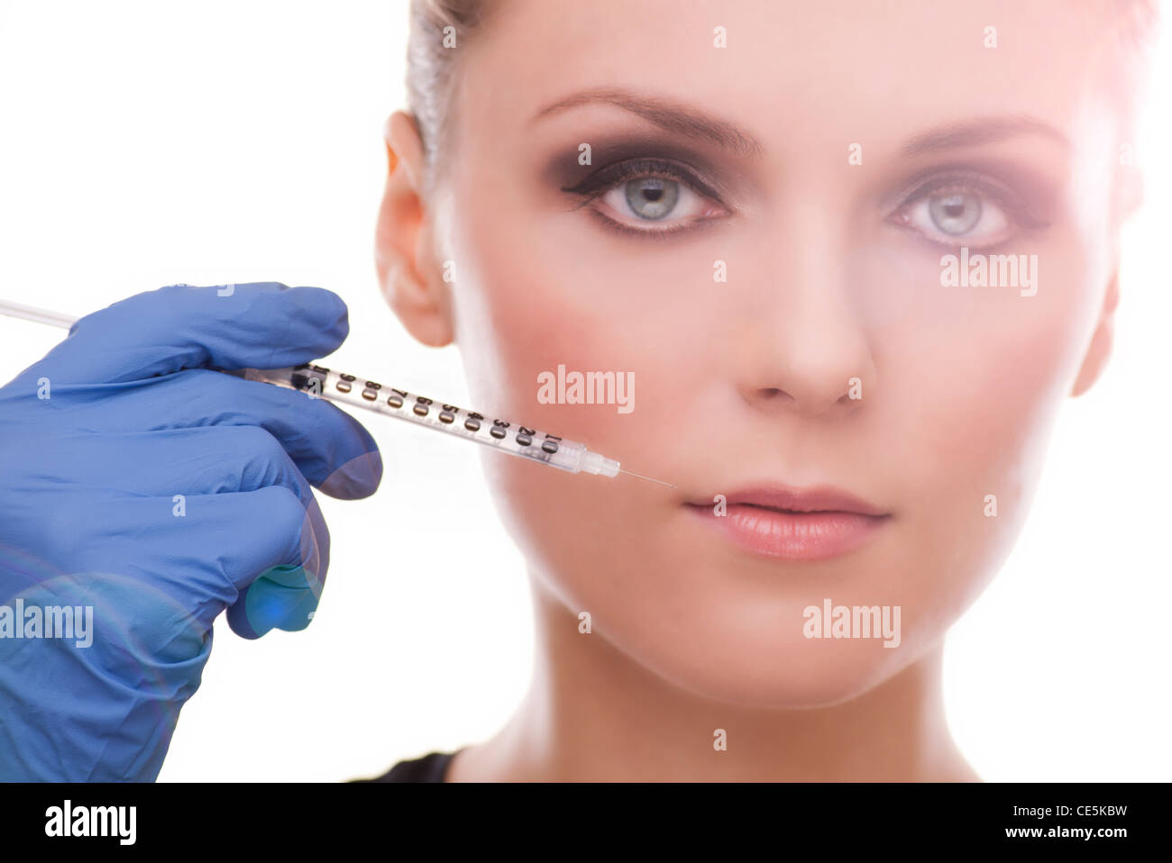 woman having lip plumping injection cosmetic surgery Stock Photo Alamy