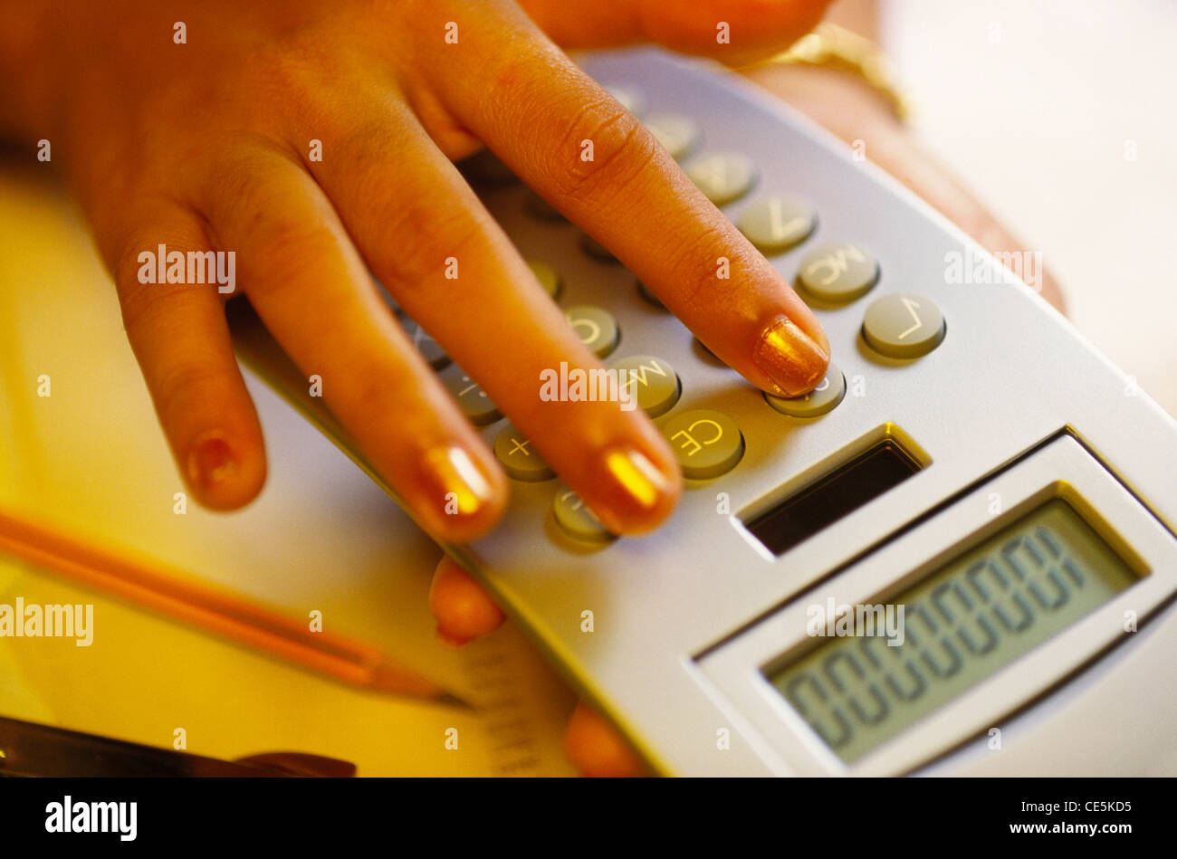 working on calculator ; MR#201 Stock Photo