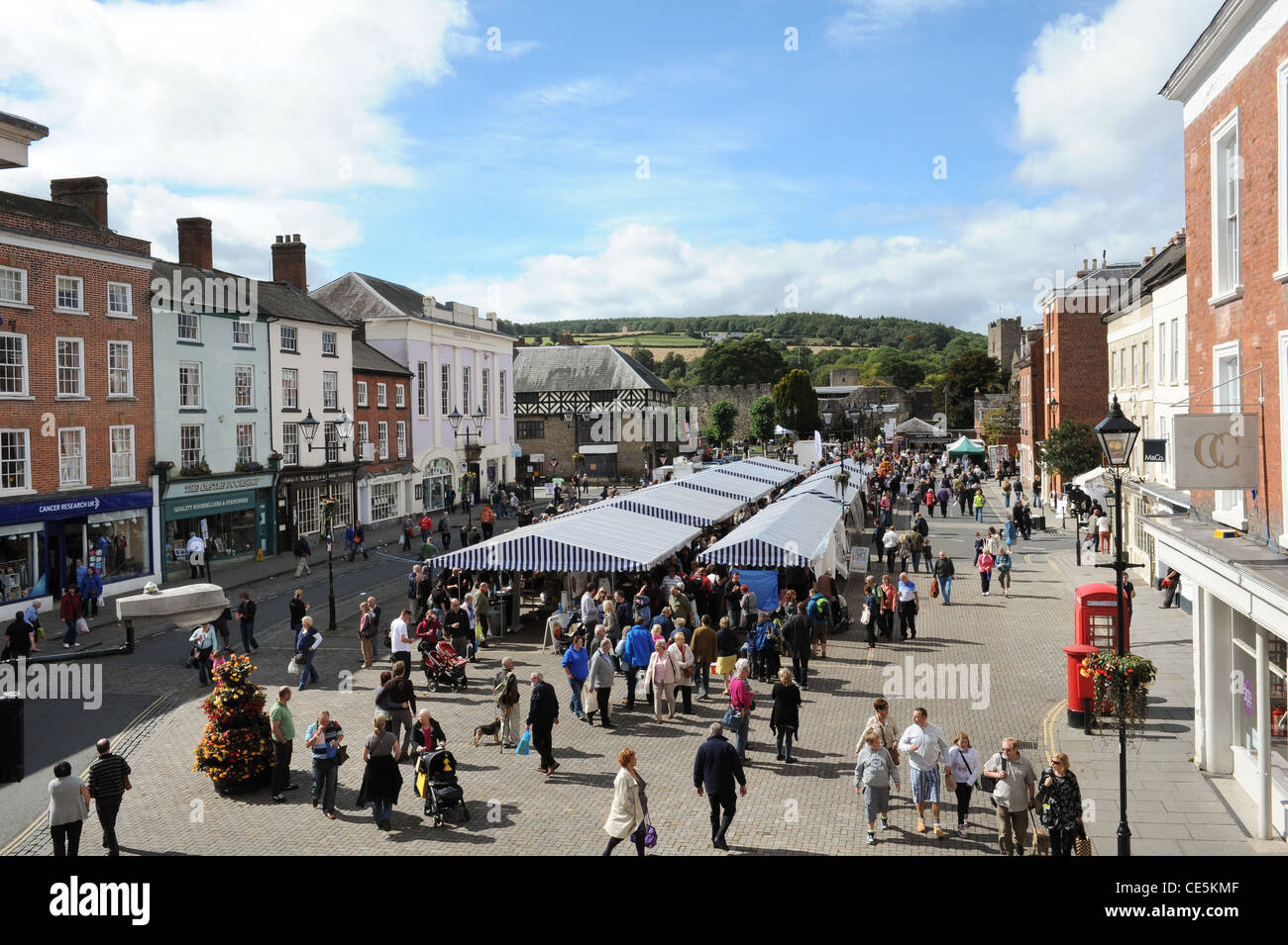 General view of Ludlow market square, looking towards Ludlow Castle on a busy day during the Ludlow Food Festival. Stock Photo