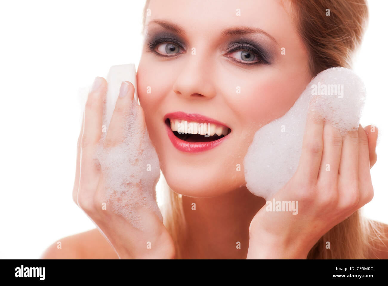 woman washing her face to remove make up Stock Photo Alamy