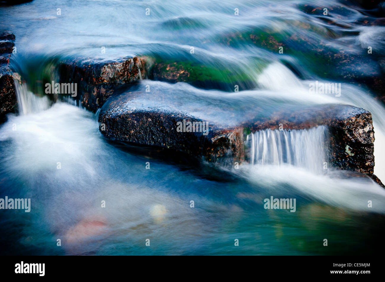 Water rushing over rocks long exposure in Glencoe Scotland Stock Photo
