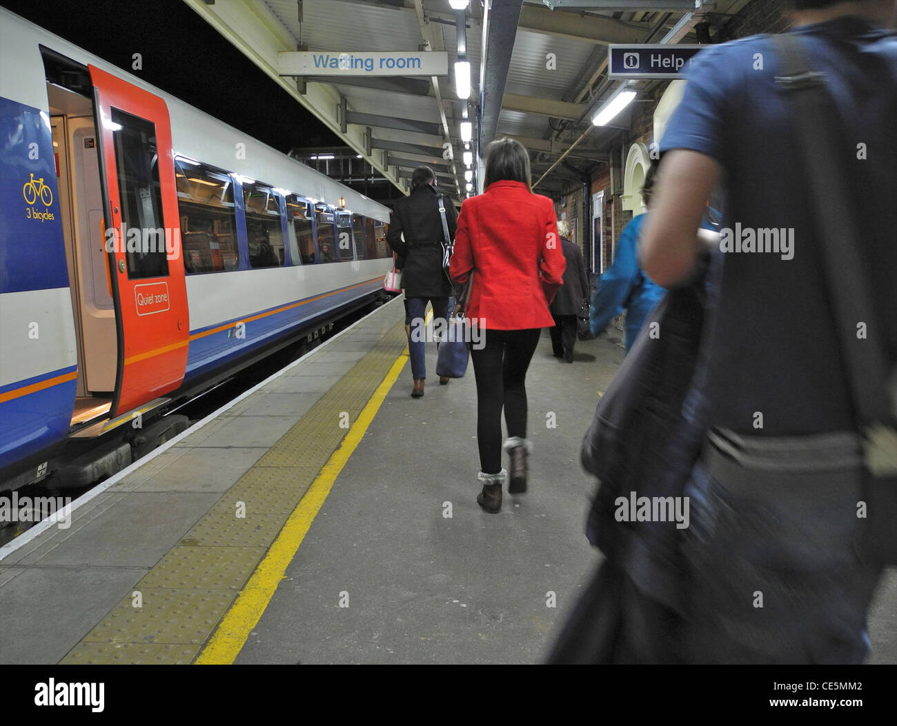 Passengers arriving on UK railway platform station EDITORIAL USE ONLY Stock Photo
