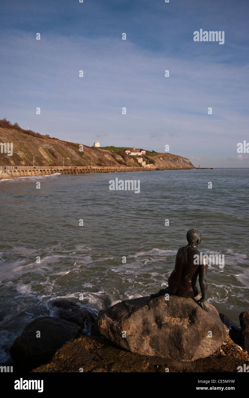 The Little Mermaid Statue On The Waterfront At Folkestone Kent UK Looking towards the sea and the cliffs Stock Photo
