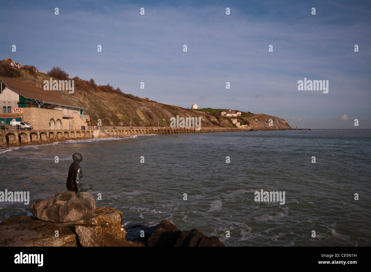The Little Mermaid Statue On The Waterfront At Folkestone Kent UK Looking towards the sea and the cliffs Stock Photo