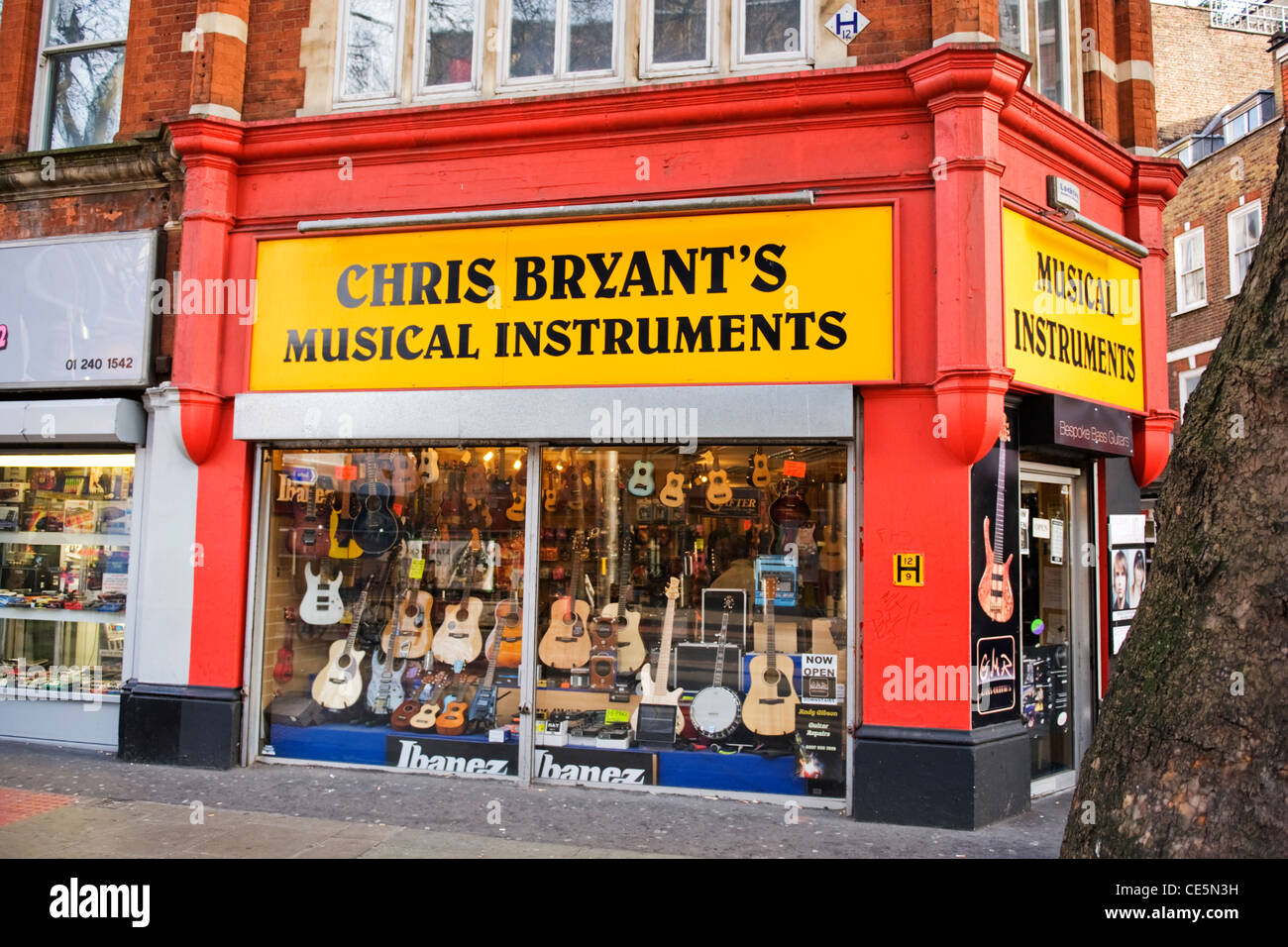 Charing Cross Road London Chris Bryant's musical instruments shop store  with guitars banjos ukelele cases Stock Photo - Alamy