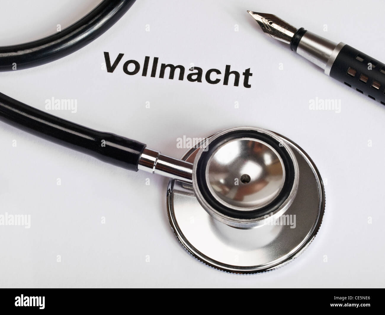 a Stethoscope and a fountain pen on sheet of paper with the word 'Procuration' in German Stock Photo
