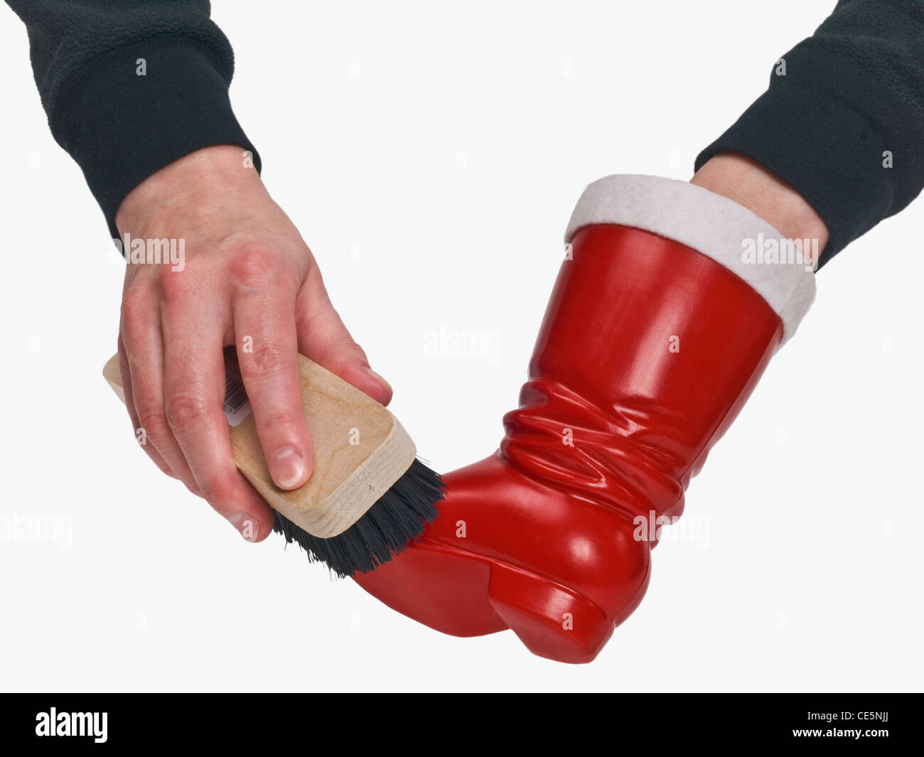 ein Nikolausstiefel wird geputzt | to give Nicholas shoes a shine Stock Photo