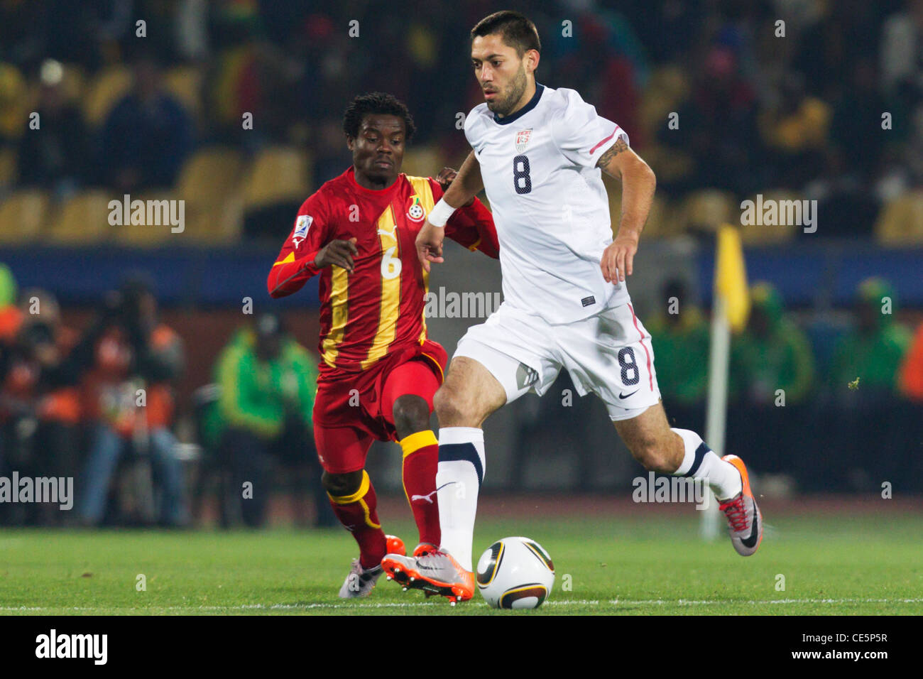 Clint Dempsey of the United States (R) on the ball against Anthony Annan of Ghana (L) during a FIFA World Cup round of 16 match. Stock Photo