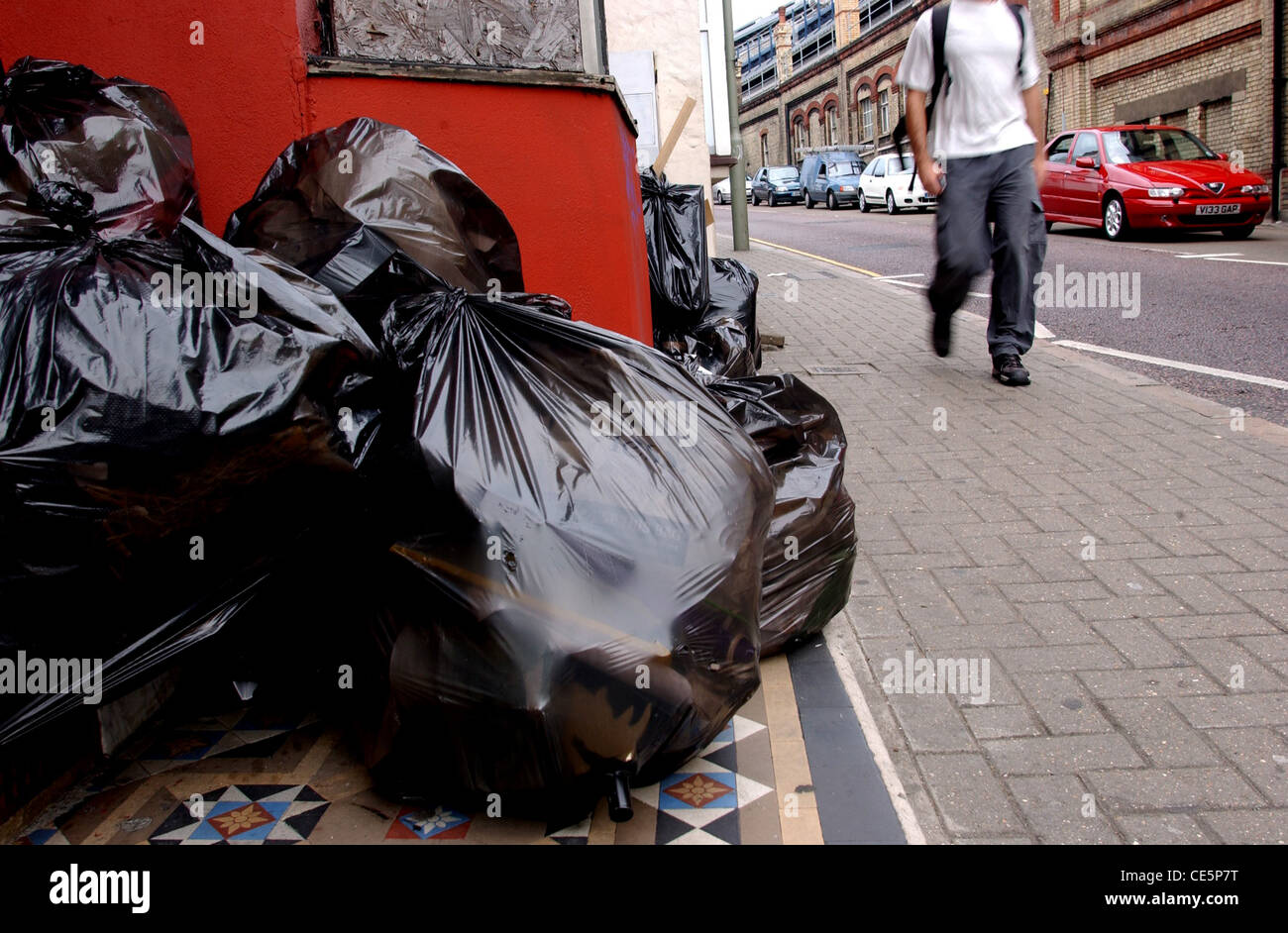 Rubbish remains uncollected in Terminus Road Brighton UK Stock Photo