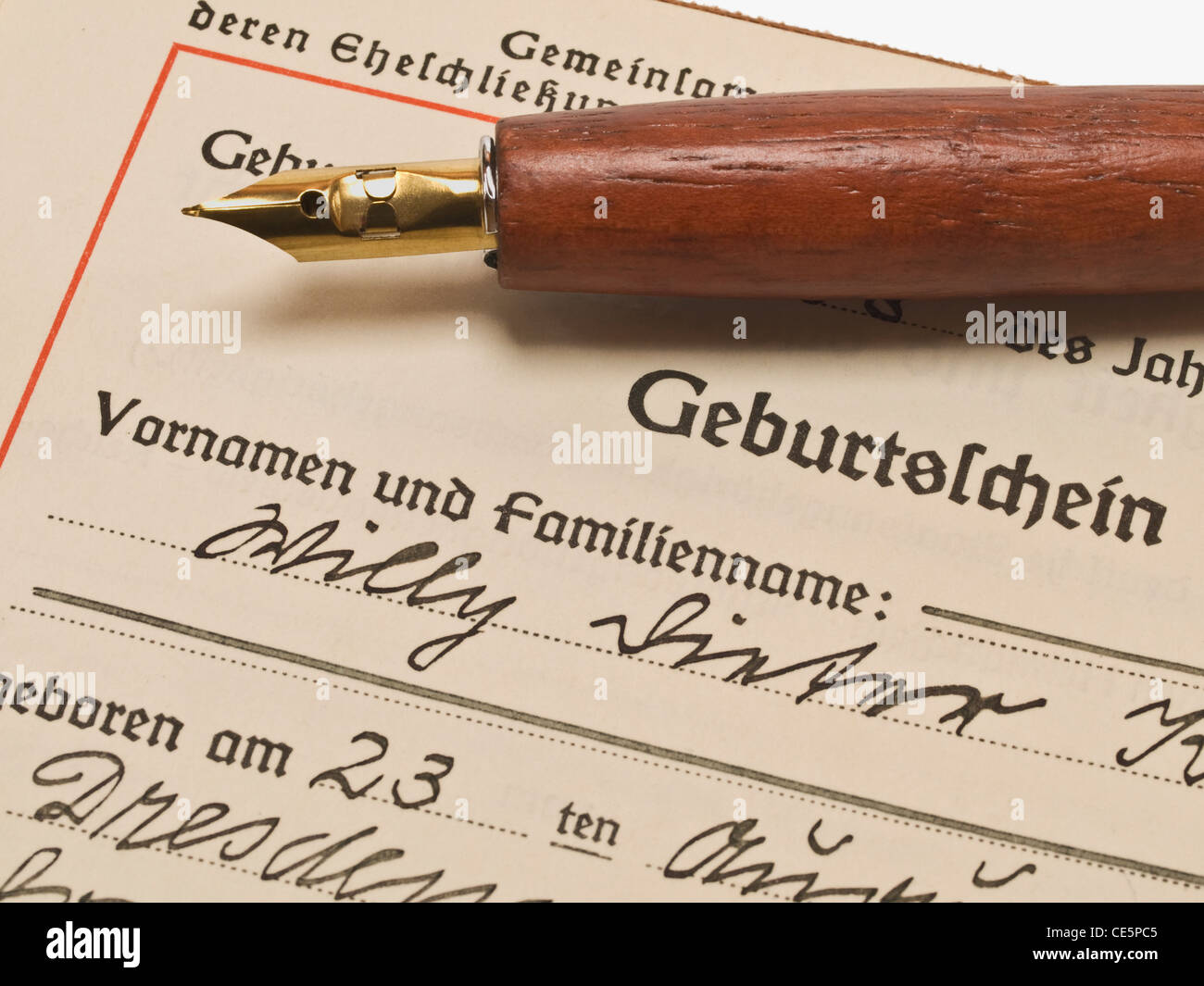Detail photo of a birth certificate from the year 1938, on it is a pen Stock Photo