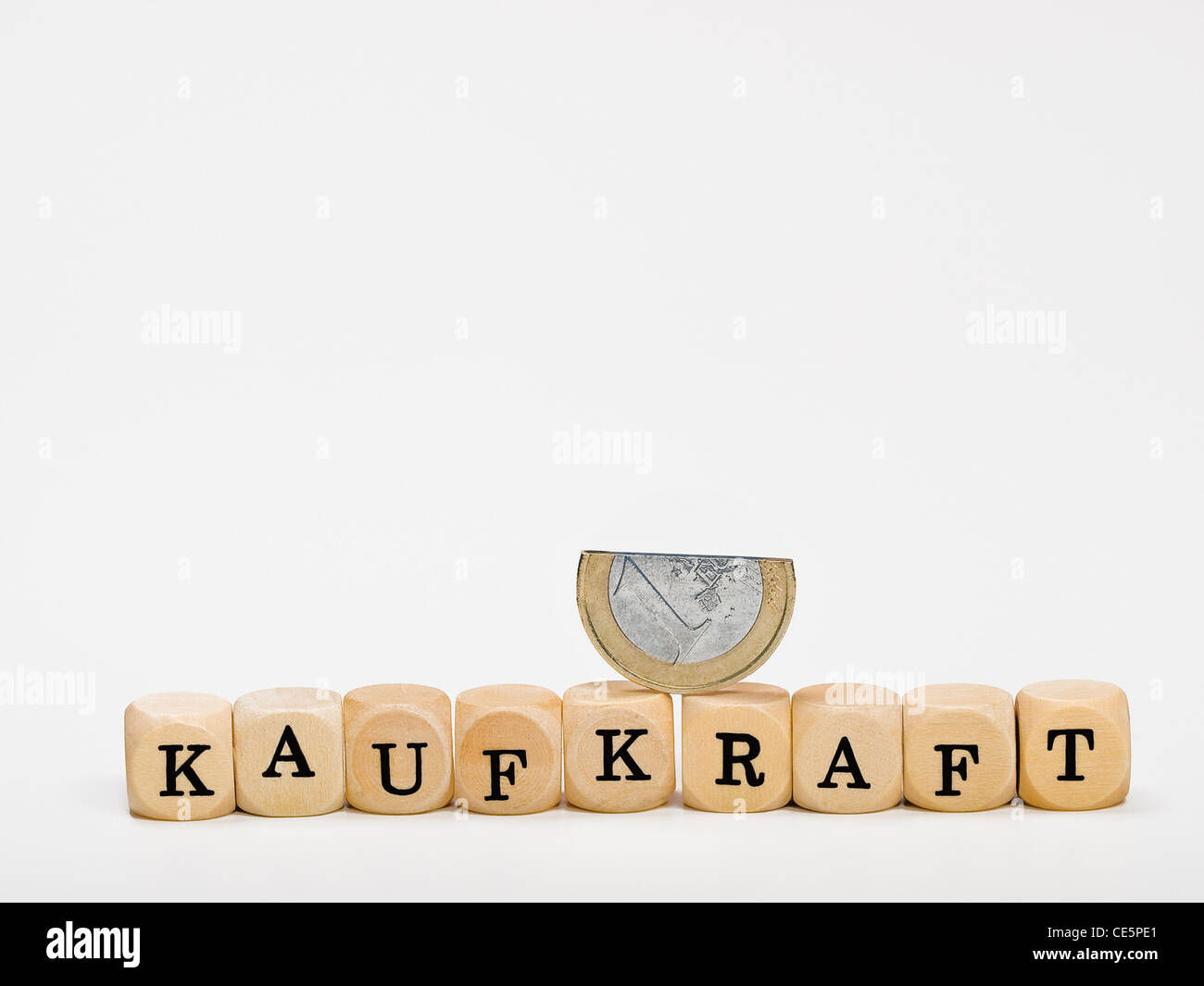 cubes which form the word 'depreciation' in German, on the cubes is a broken 1 Euro coin Stock Photo