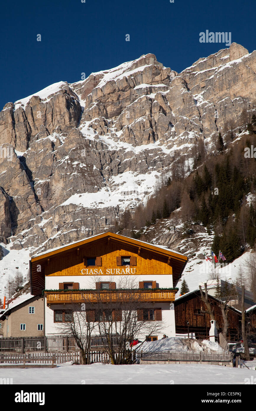 House in front of the Sella massif, Kolfuschg, Colfosco, Gader valley, Val Badia, Alta Badia, Dolomites, South Tyrol, Italy Stock Photo