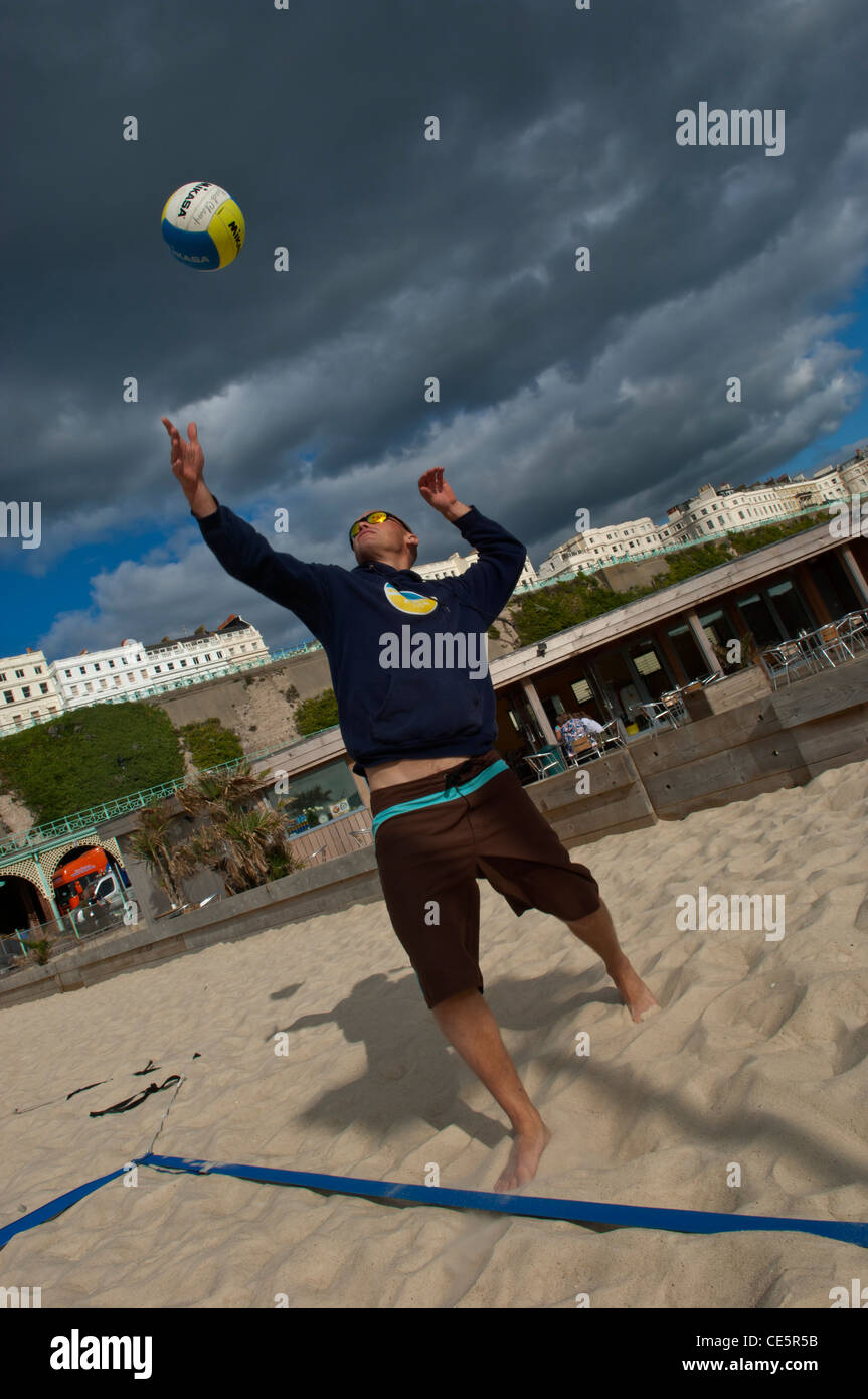 People playing beach volleyball on the sands at Yellowave Beach Sports Centre, Brighton. East Sussex. England.UK Stock Photo