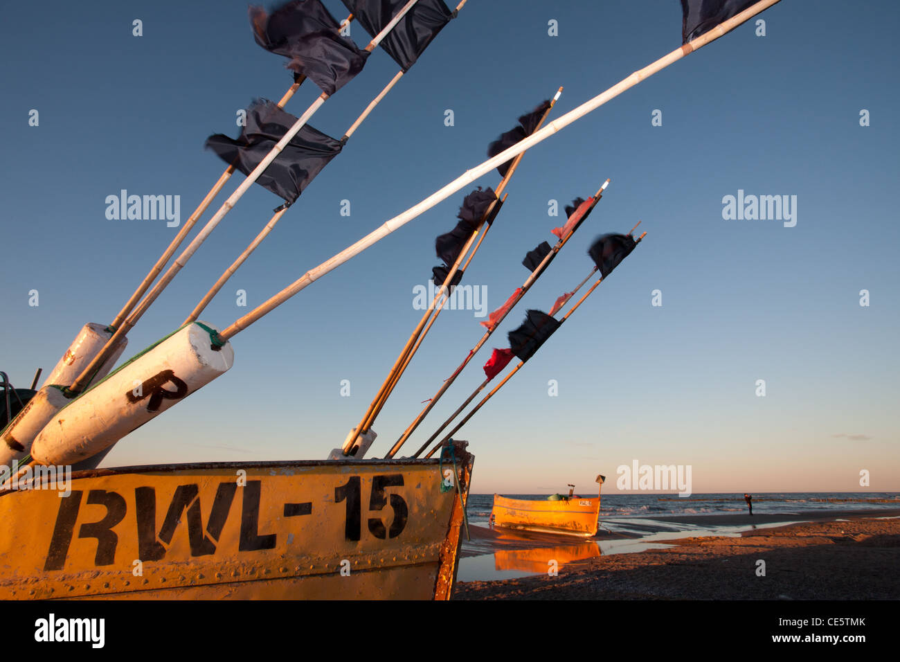 Fishing Boats on the beach in Rewal City. Sunset in the autumn, Baltic Coast, Poland. Stock Photo