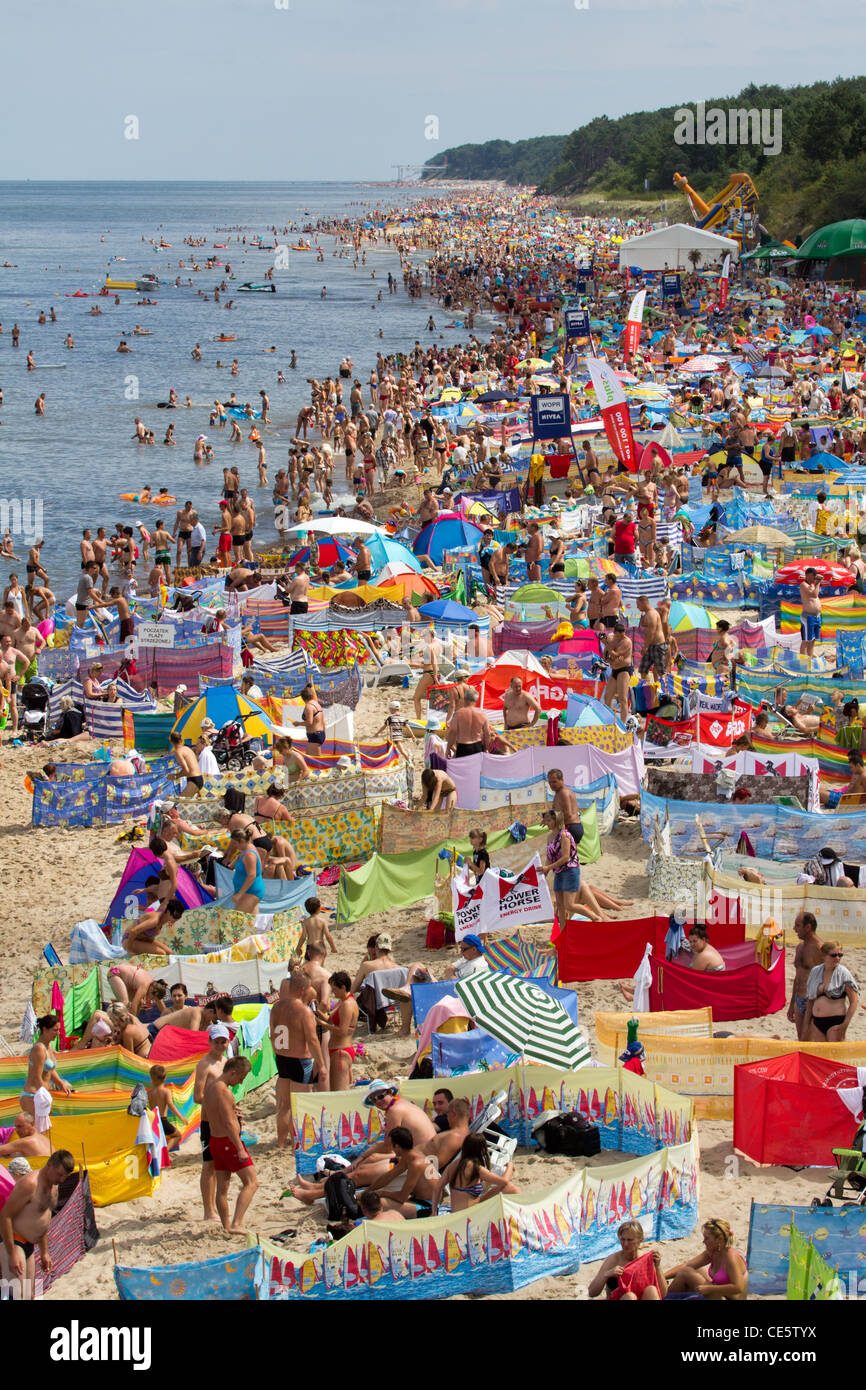 Beach full of tourists, summer in the city "Pobierowo", on the west coast of the Baltic Sea in Poland. Stock Photo