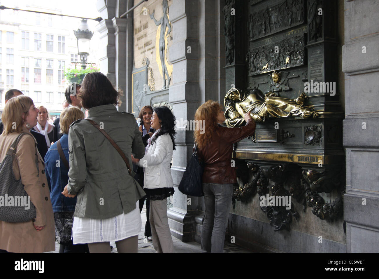 Tourists rub the Everard 't Serclaes statue in Brussels, Belgium Stock Photo