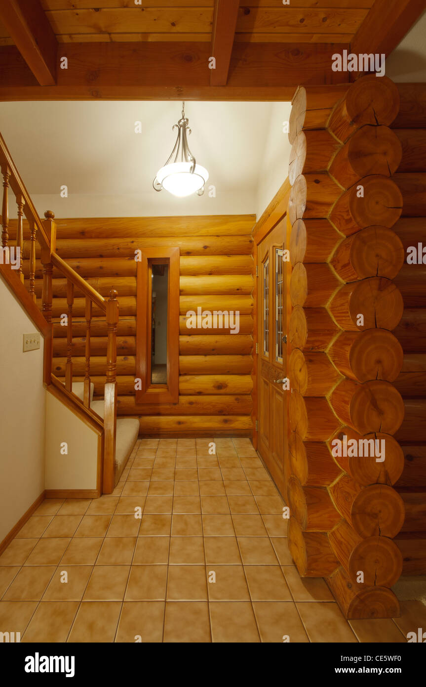 Hallway Leading To Stairs In Vestibule In Luxury Log Cabin Shows