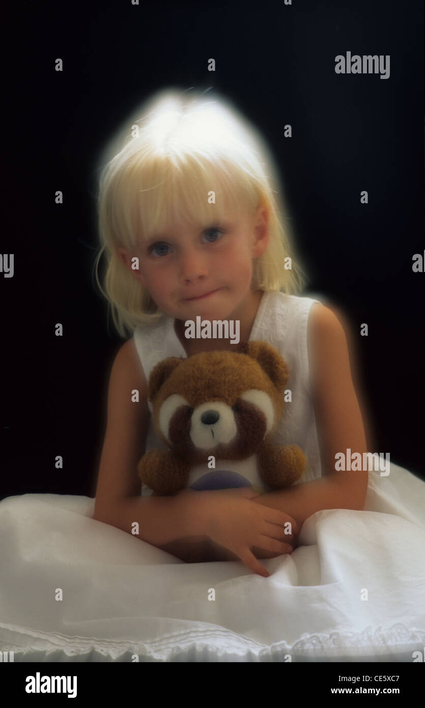 Child with teddy bear hi-res stock photography and images - Alamy