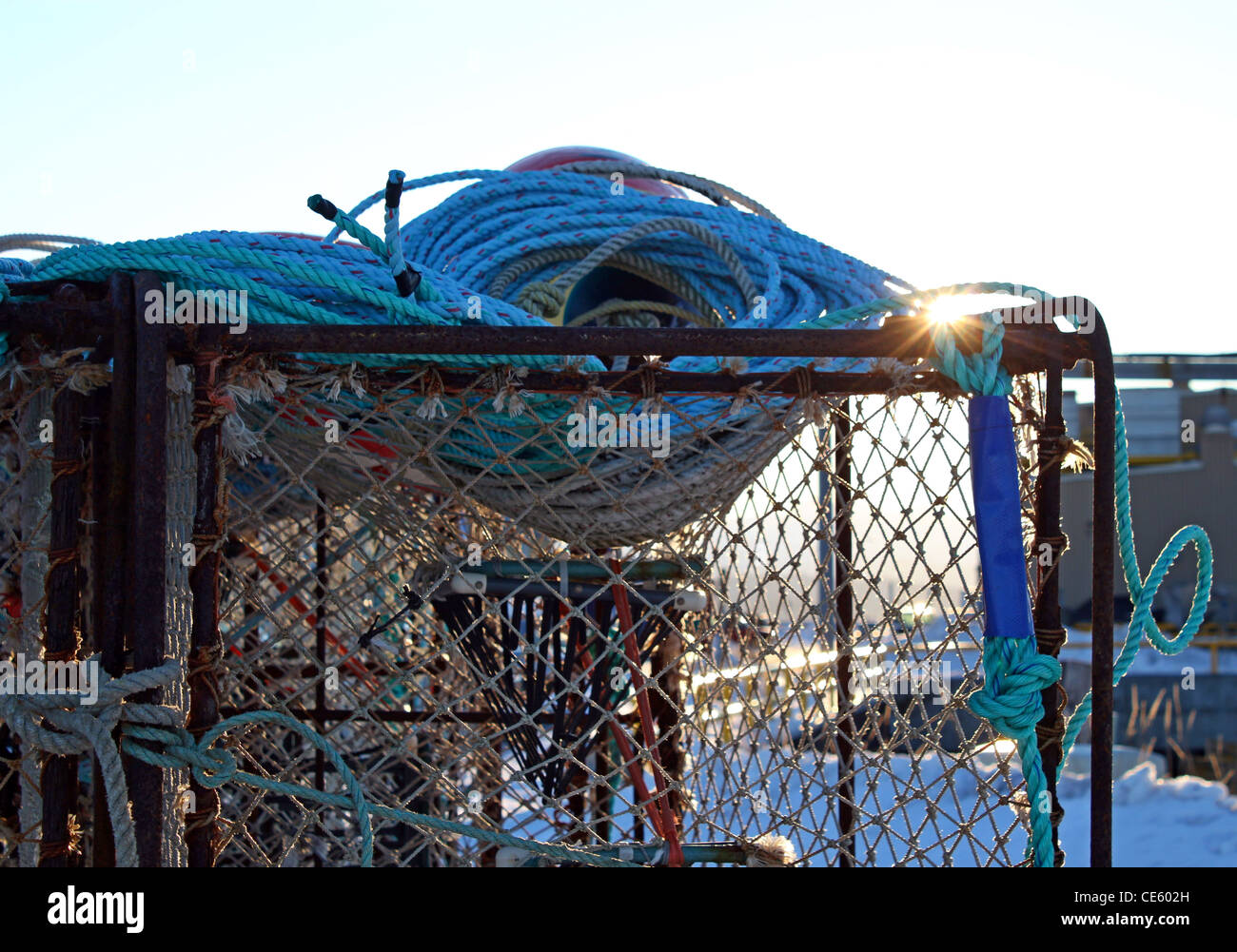 Close up of commercial crab pots at the fish processing dock in Homer  Alaska with the glint of the setting sun Stock Photo - Alamy