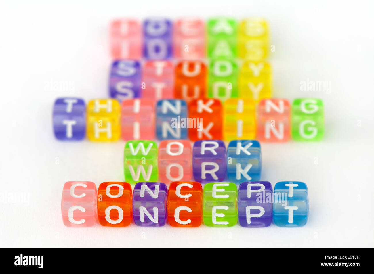 Text Concept on colorful cubes over white. Texts study, work, thinking and idea blurred on background Stock Photo