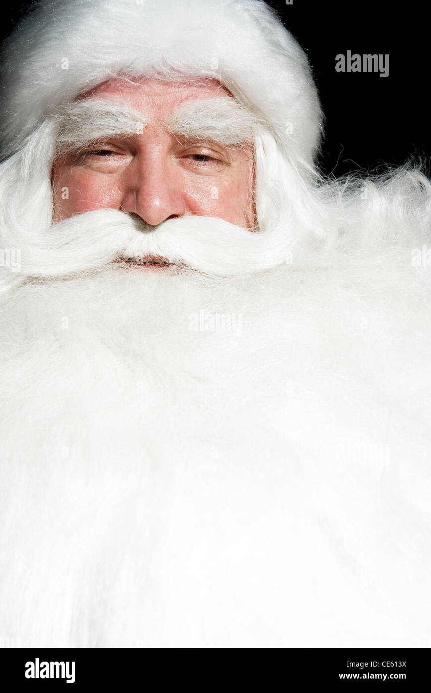 Santa Claus Portrait smiling isolated over a black background Stock ...