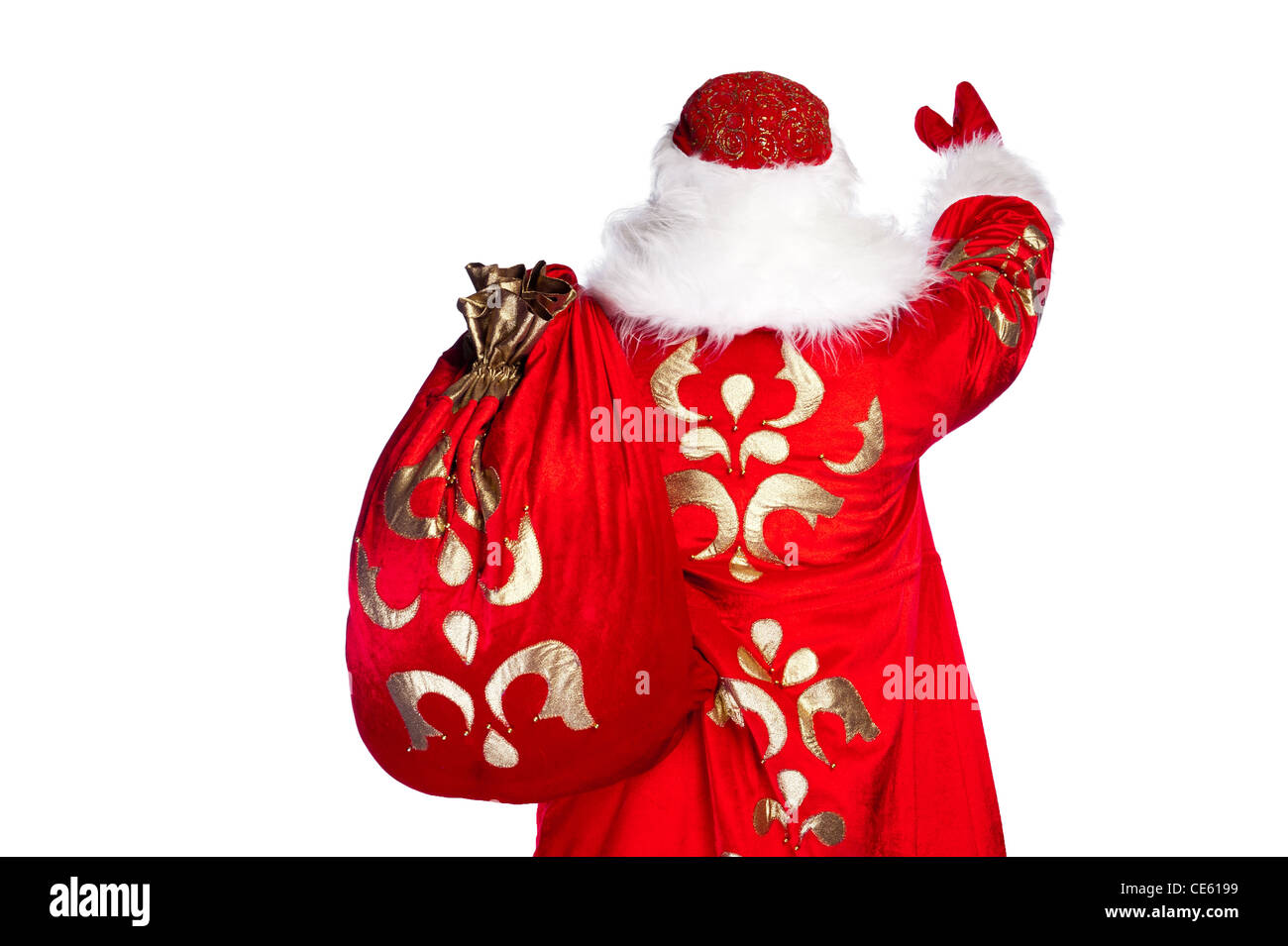 Santa Claus standing up on white background with his bag full of gifts ...