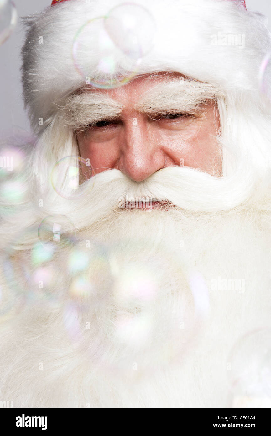 Santa Claus Portrait smiling isolated over a white background and soap ...