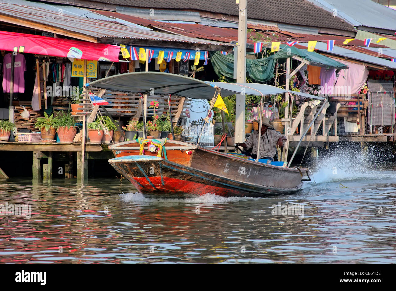 Long-tail boat at Amphawa Floating Market, Thailand Stock Photo