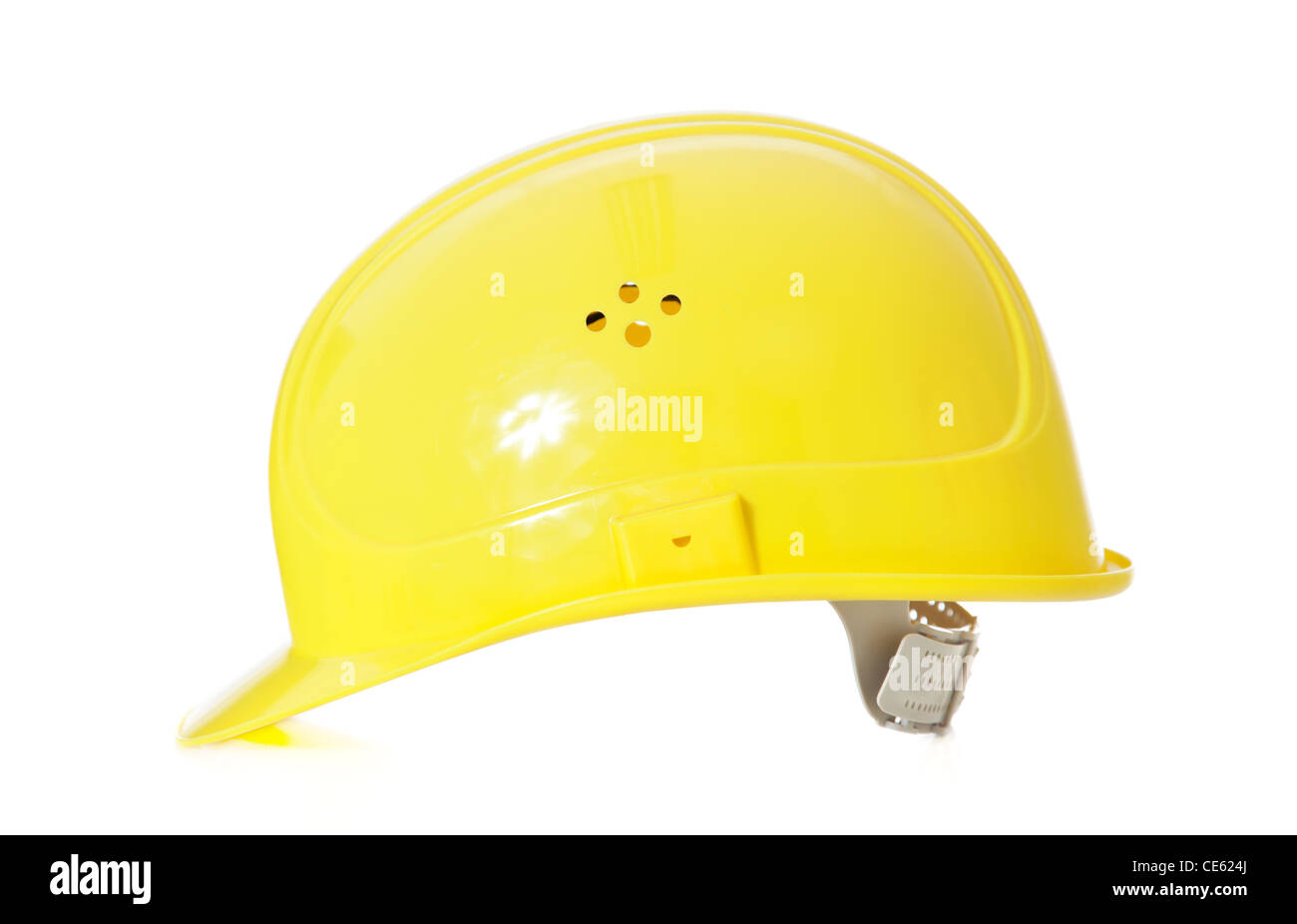 Standard yellow hard hat. All on white background. Stock Photo