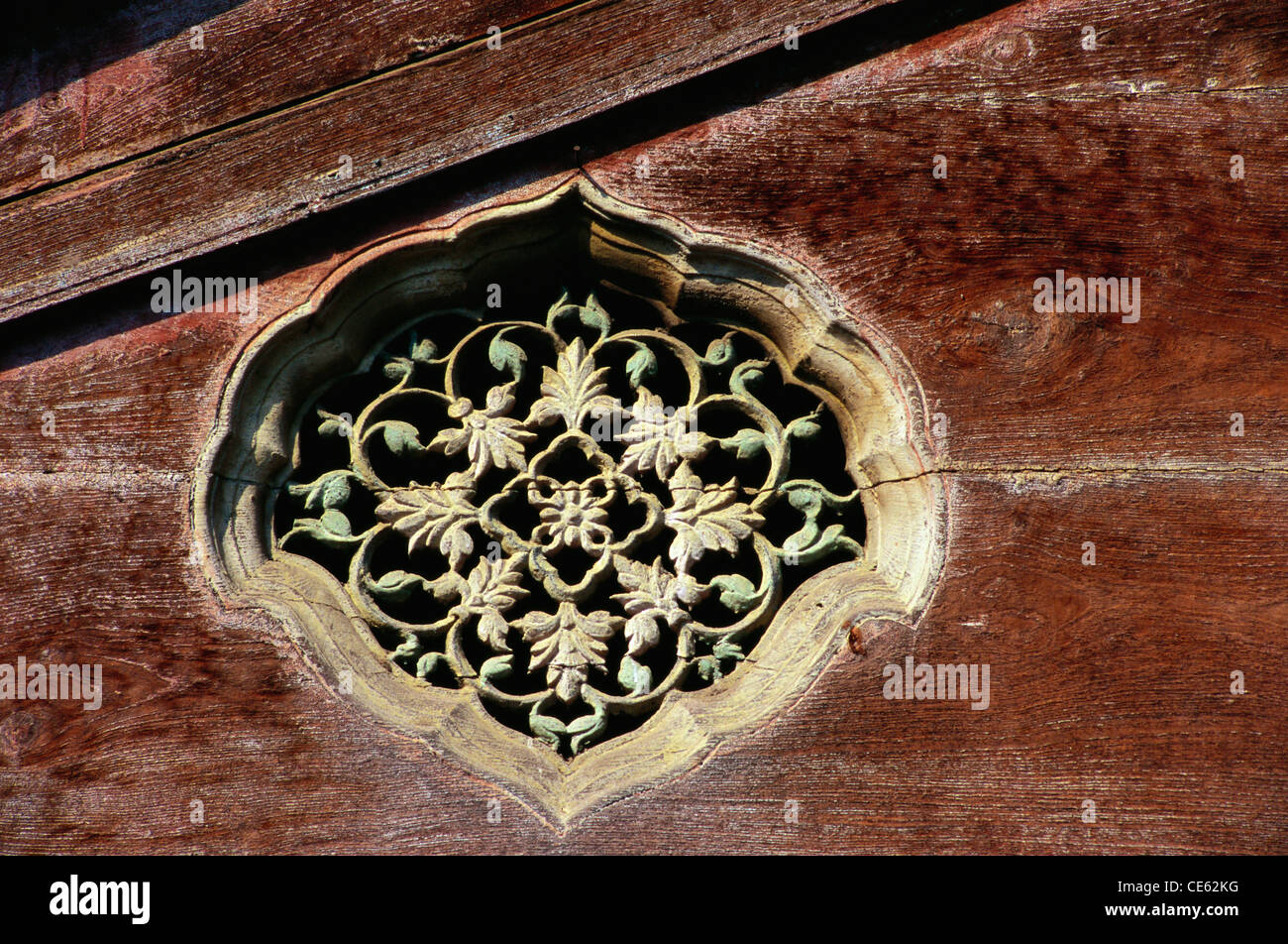 Richly wood carved grill jali window of Shri Ram temple Tulsi Bagh Pune Maharashtra India Stock Photo