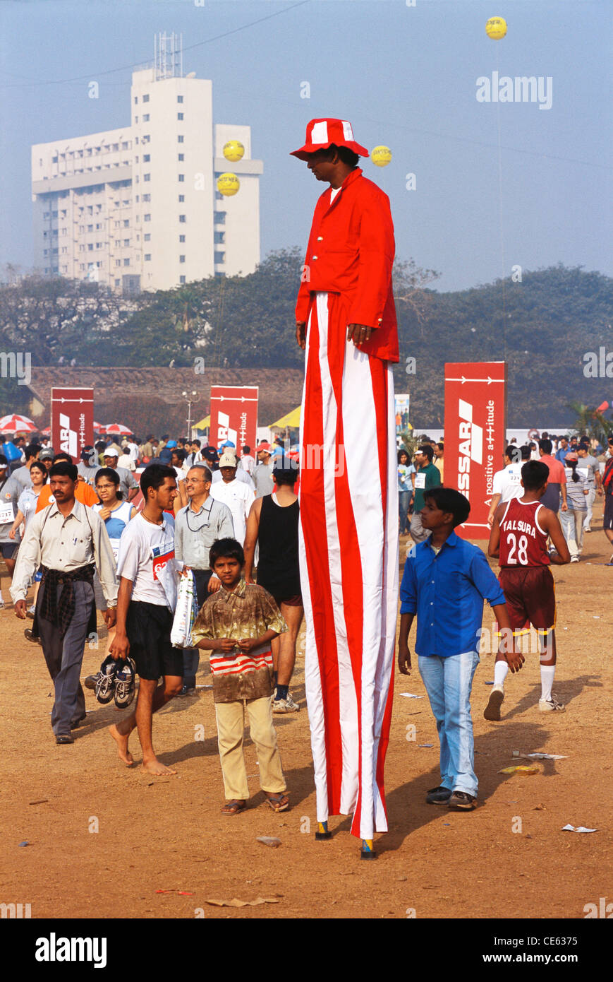 Man on stilts costume fancy dress ; Bombay Mumbai ; Maharashtra ; India Stock Photo