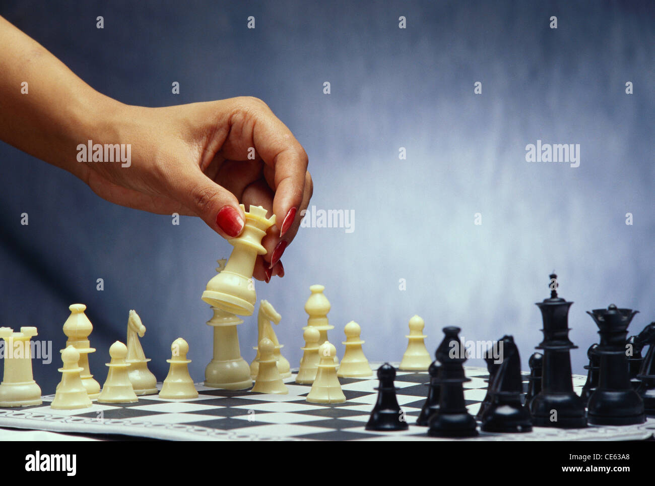 Hand moving white chess piece playing game of chess MR#234 Stock Photo ...