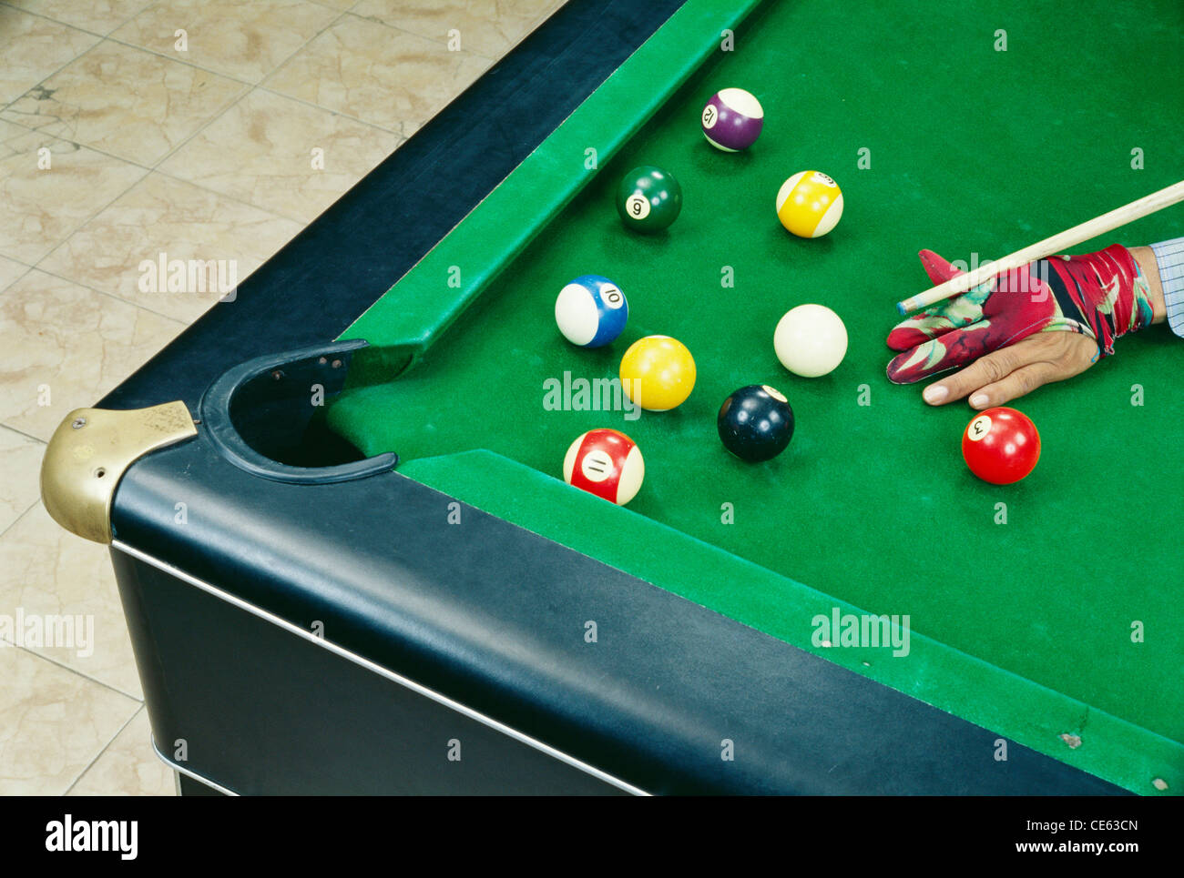 playing billiards pool balls on pool table playing with cue ball Stock