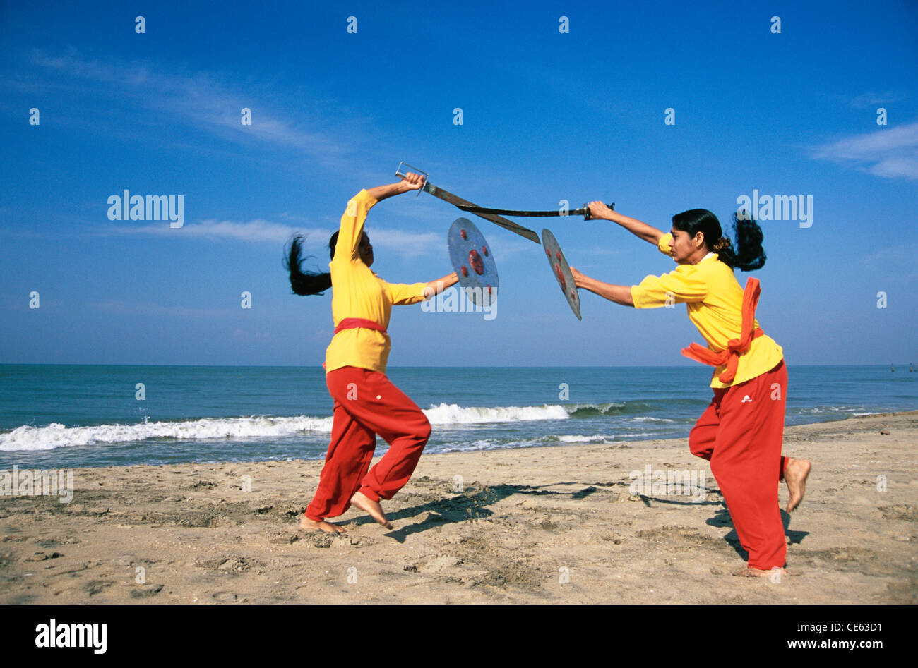 Kalaripayattu ancient martial art of Kerala showing sword and shield fighting at beach kerala Stock Photo