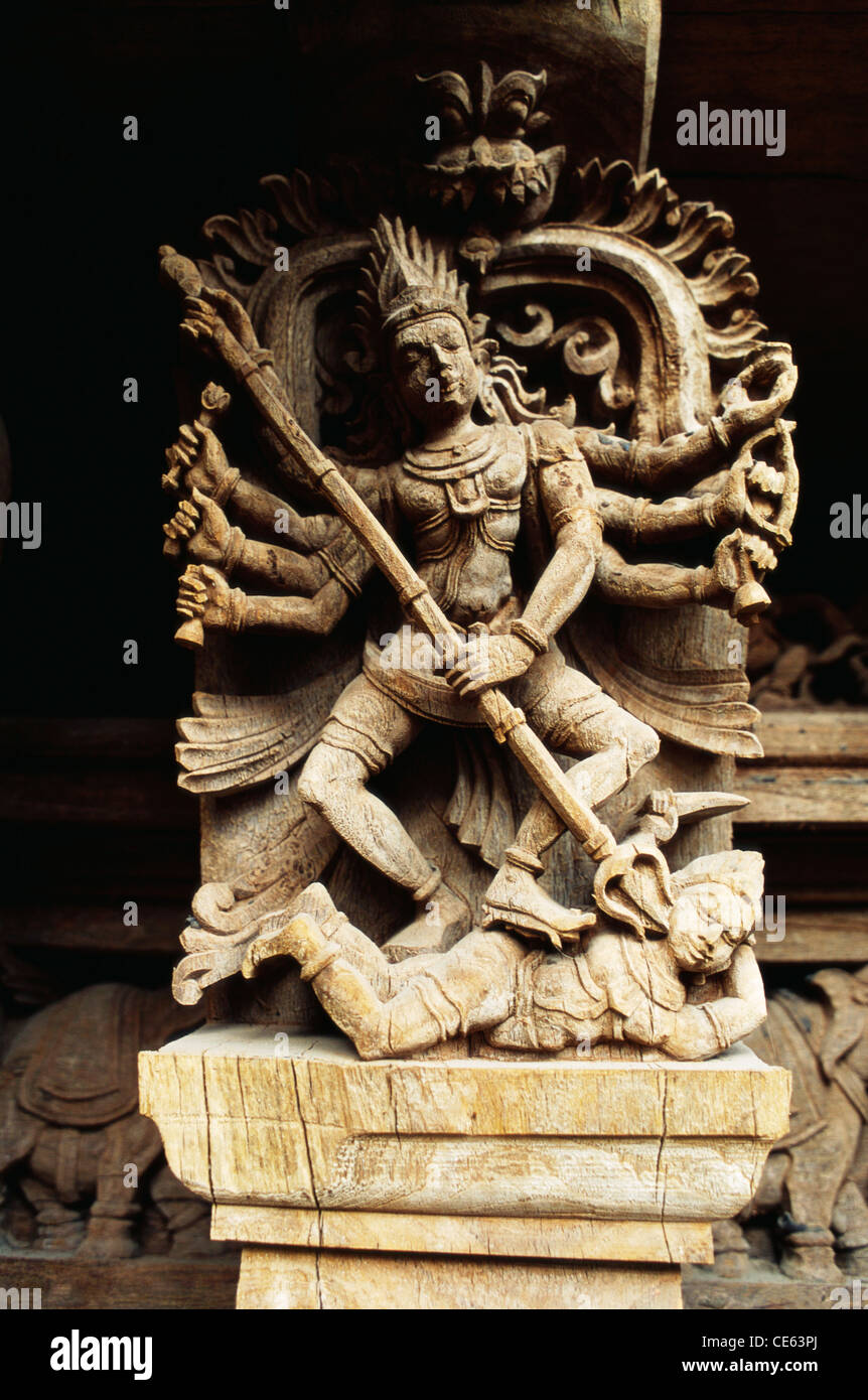 17th century wood carving God killing demon with trident in temple chariot at Madurai ; Tamil Nadu ; India Stock Photo