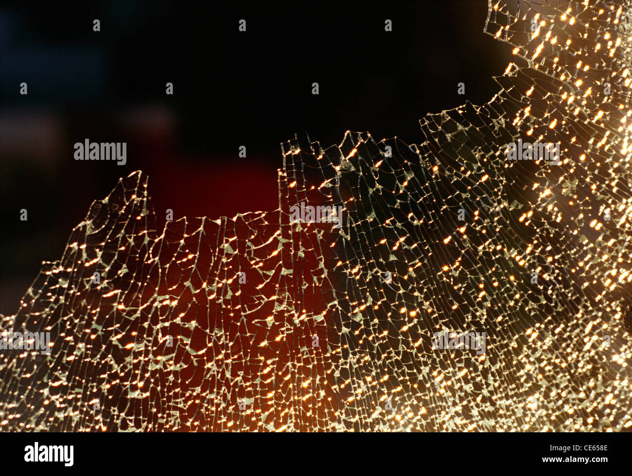 Shattered glass ; broken glass ; broken into very small pieces ; India ; Asia Stock Photo
