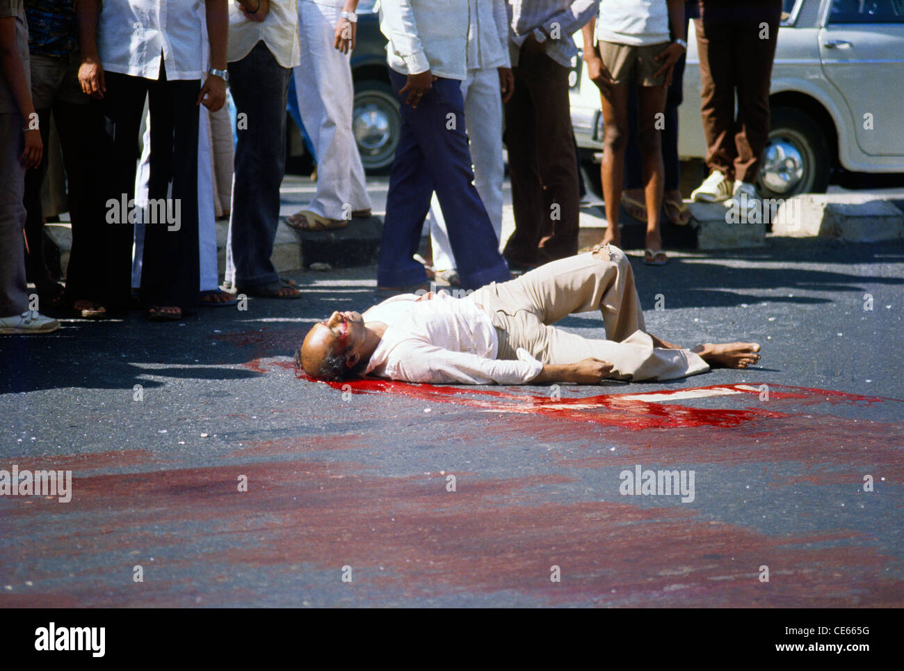 Wiegedood There's Always Blood At The End Of The Road Dead man lie down in blood on road ; Bombay Mumbai ; Maharashtra Stock
