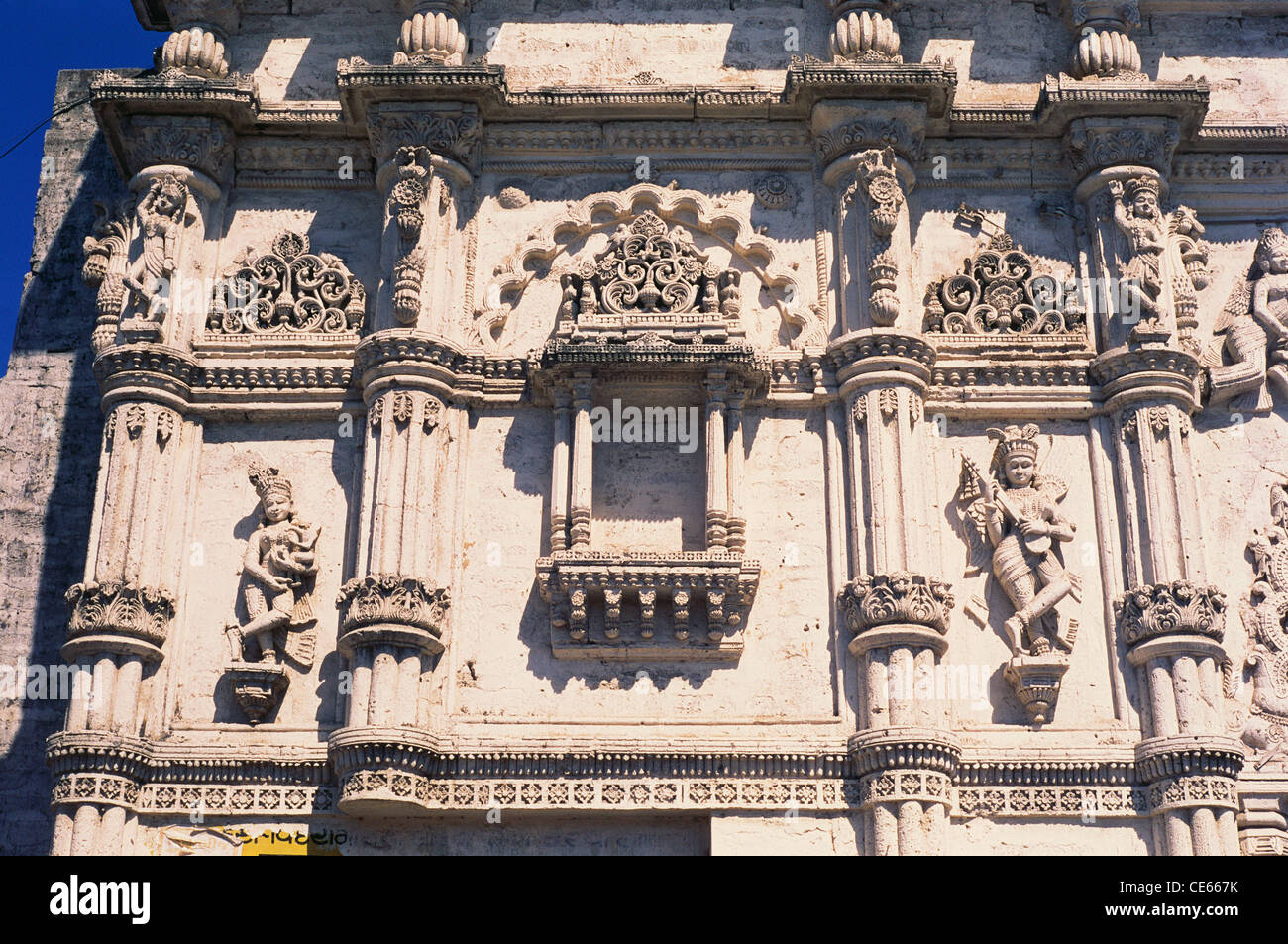 Sculptures and decorated facade ; Khambhalia Gate ; Khambhaliya Gate ; Khambalia Gate ; Jamnagar ; Gujarat ; India ; Asia Stock Photo