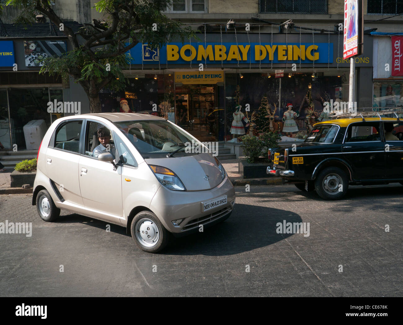 A Tata Nano car on the street in Mumbai India Stock Photo