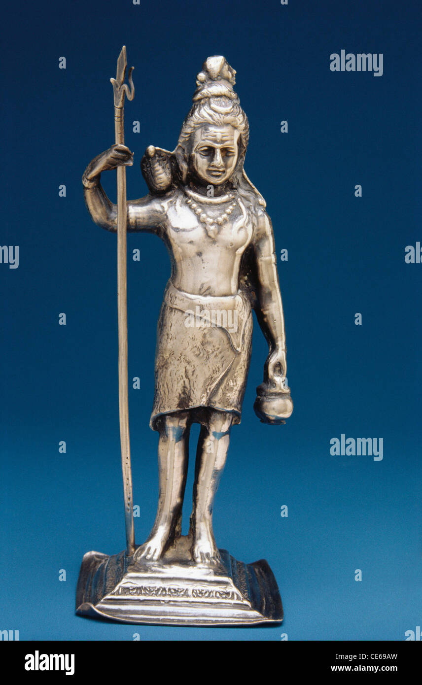 Silver idol of god Shiva standing with trishul Stock Photo - Alamy