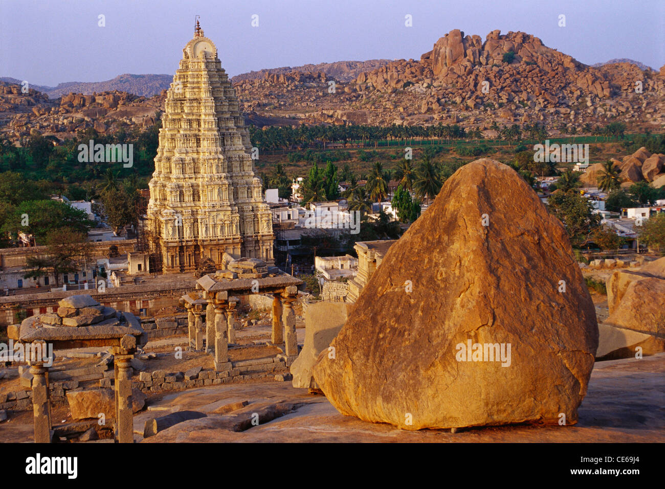 Virupaksha Temple ; huge boulder and Gopuram ; Hampi ; UNESCO World Heritage Site ; Ballari district  ; Hospet ; Karnataka ; India ; Asia Stock Photo