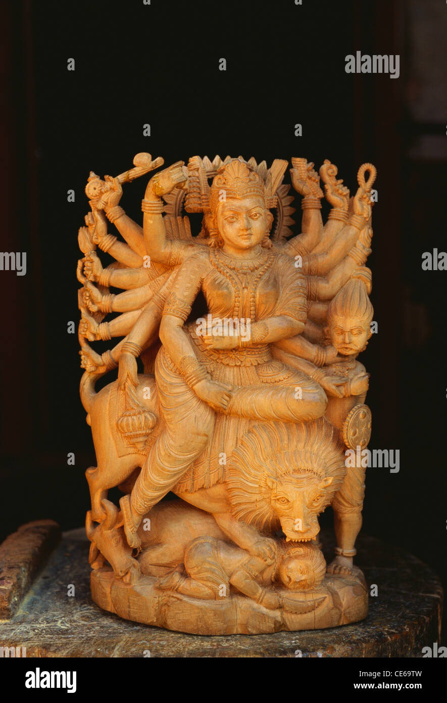 Chamundeshwari ; Chamunda ; Charchika ; Rakta Kali ; Chandi ; Chamundeswari ; mahishasura mardini ; Hindu Goddess Parvati ; sandalwood sculpture ; Stock Photo