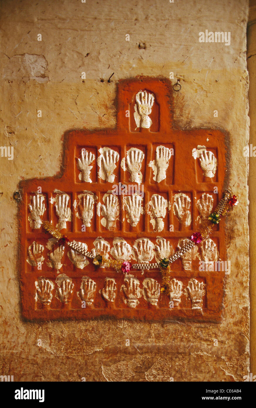 Sati handprints mural to mark self immolation by woman at Loha Pol, Iron Gate ; Mehrangarh Fort Palace and Museum ; Jodhpur ; Rajasthan ; India ; Asia Stock Photo