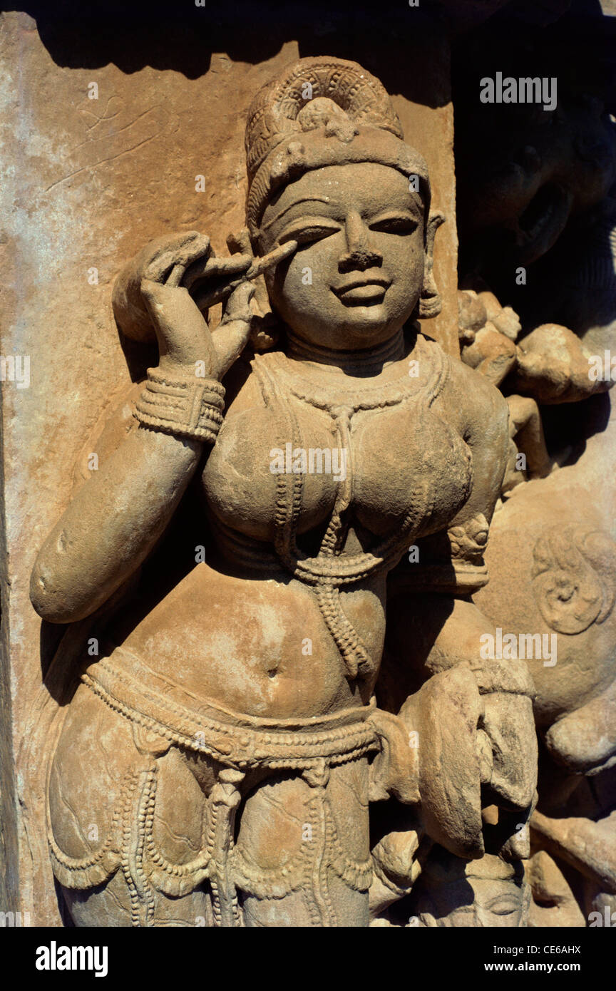 kohl woman applying kajal eye liner eyeliner statue of lady doing make