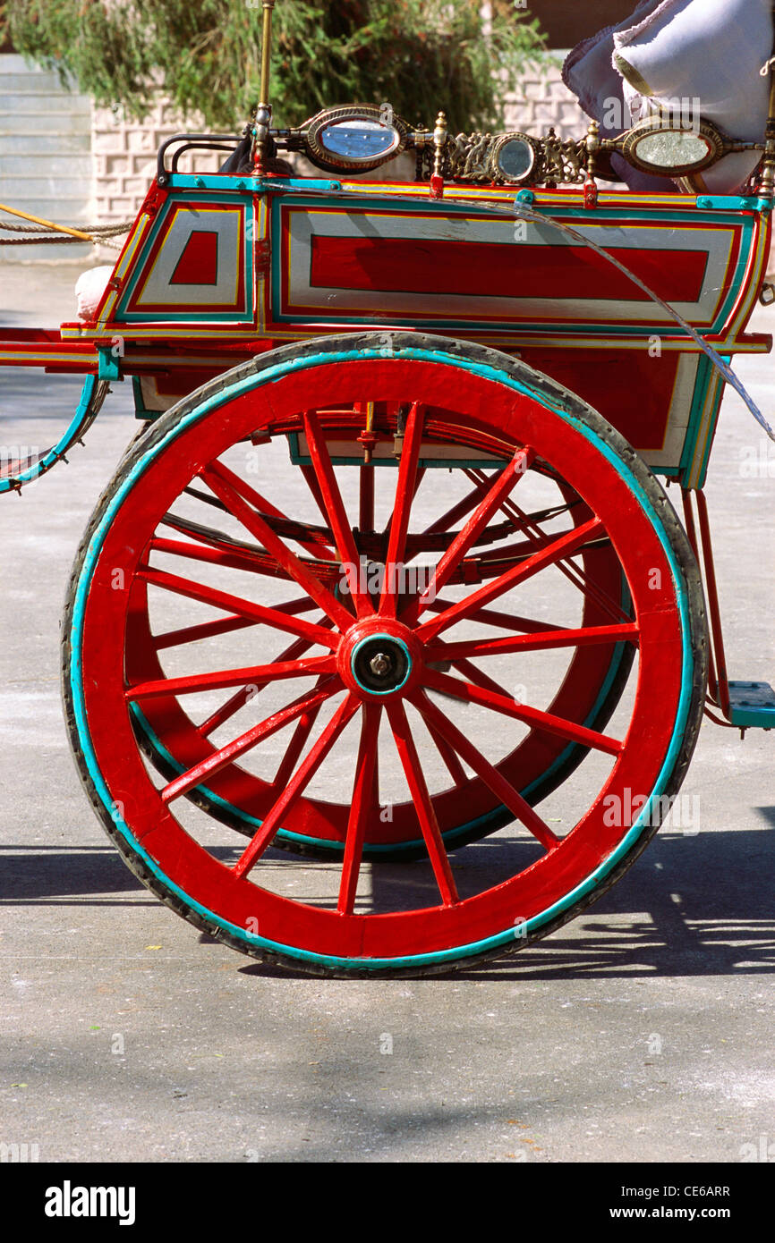 Wheels painted red of tonga ; tanga ; horse cart ; horse carriage ; Ujjain ; Madhya Pradesh ; India ; Asia Stock Photo