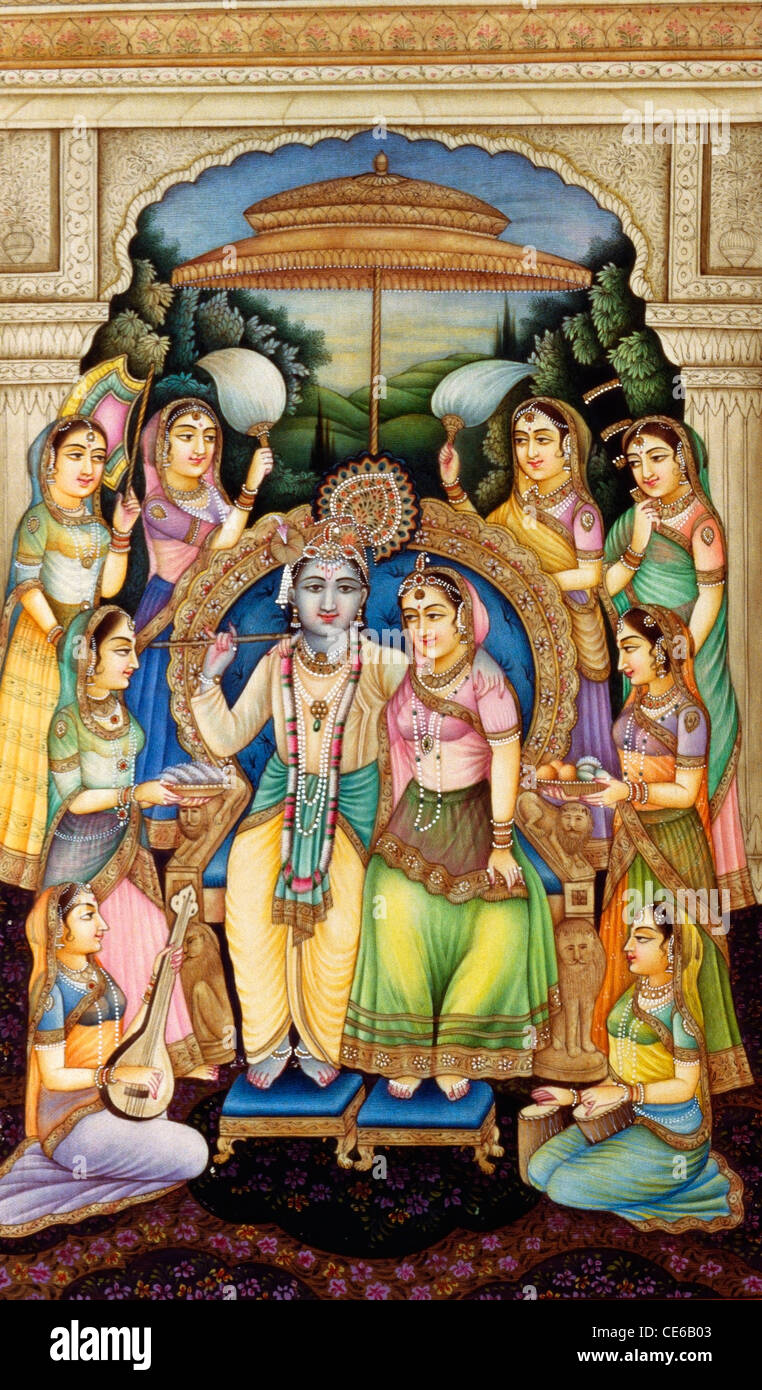 Radha Krishna sitting on throne attended by gopis dasis gopikas   miniature painting on ivory Stock Photo