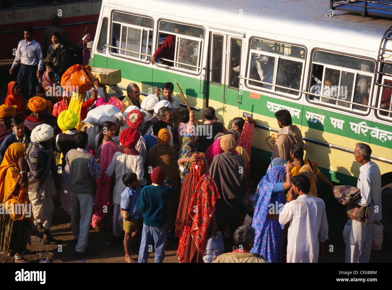 crowd waiting to enter bus at Pushkar fair Rajasthan India Stock Photo