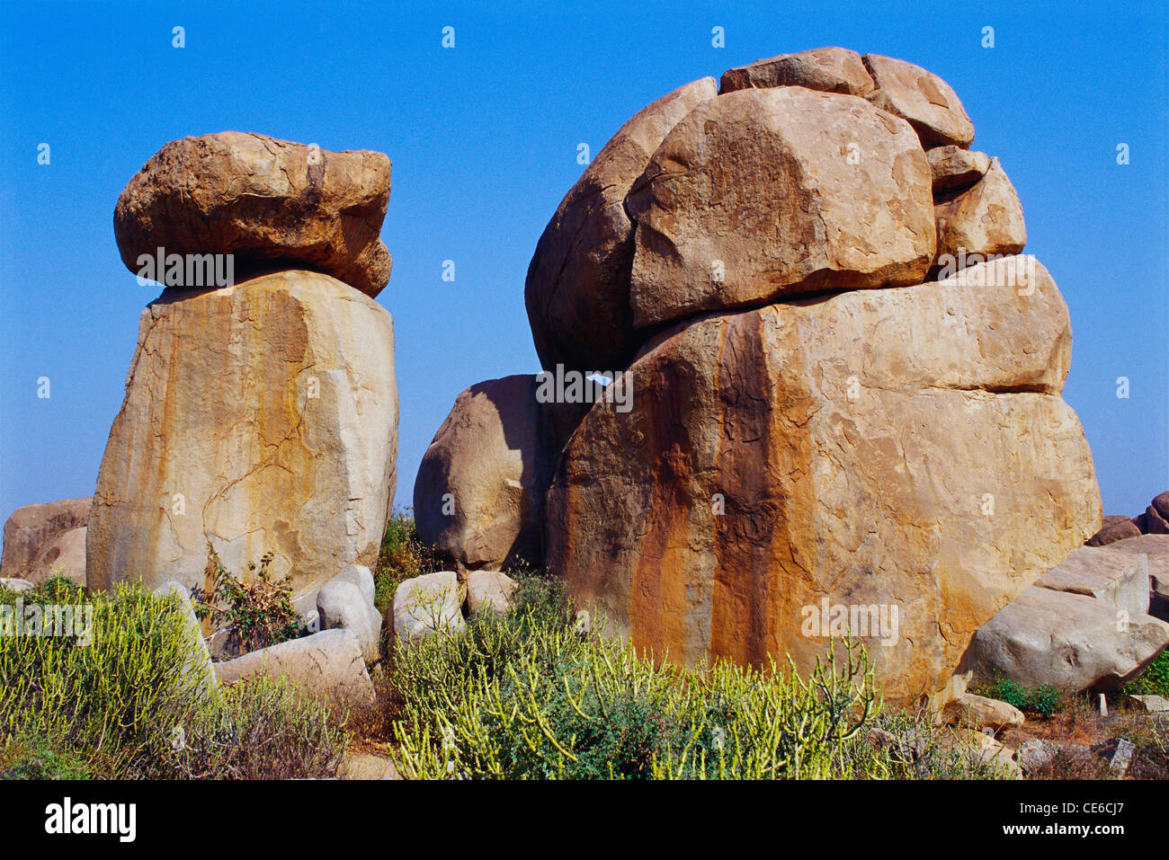 rock sculpture balancing stone huge boulders ; Hampi ; Hospet ; Karnataka ; india Stock Photo